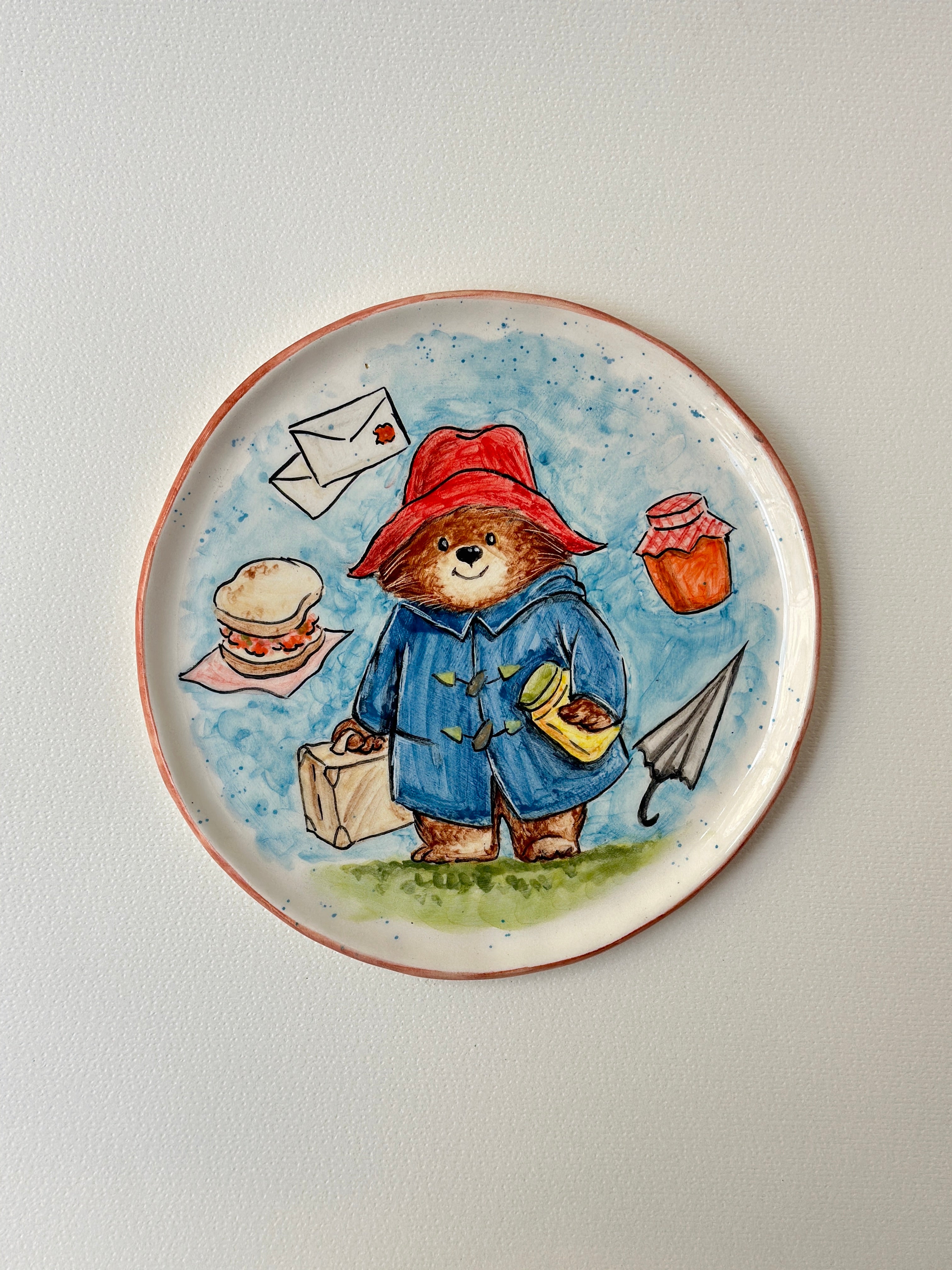 A red- padded Bear who loves marmalade handmade plate