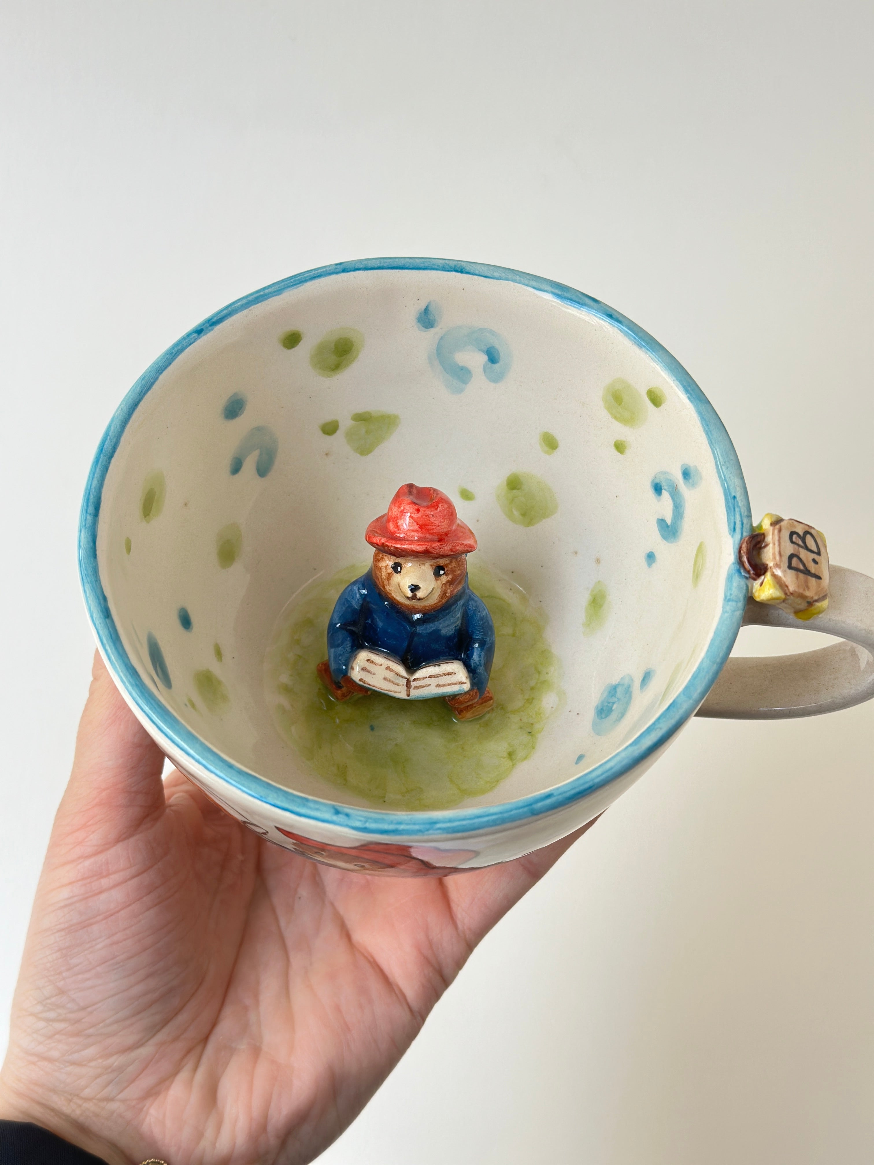 A red padded Bear who loves marmalade handmade mug