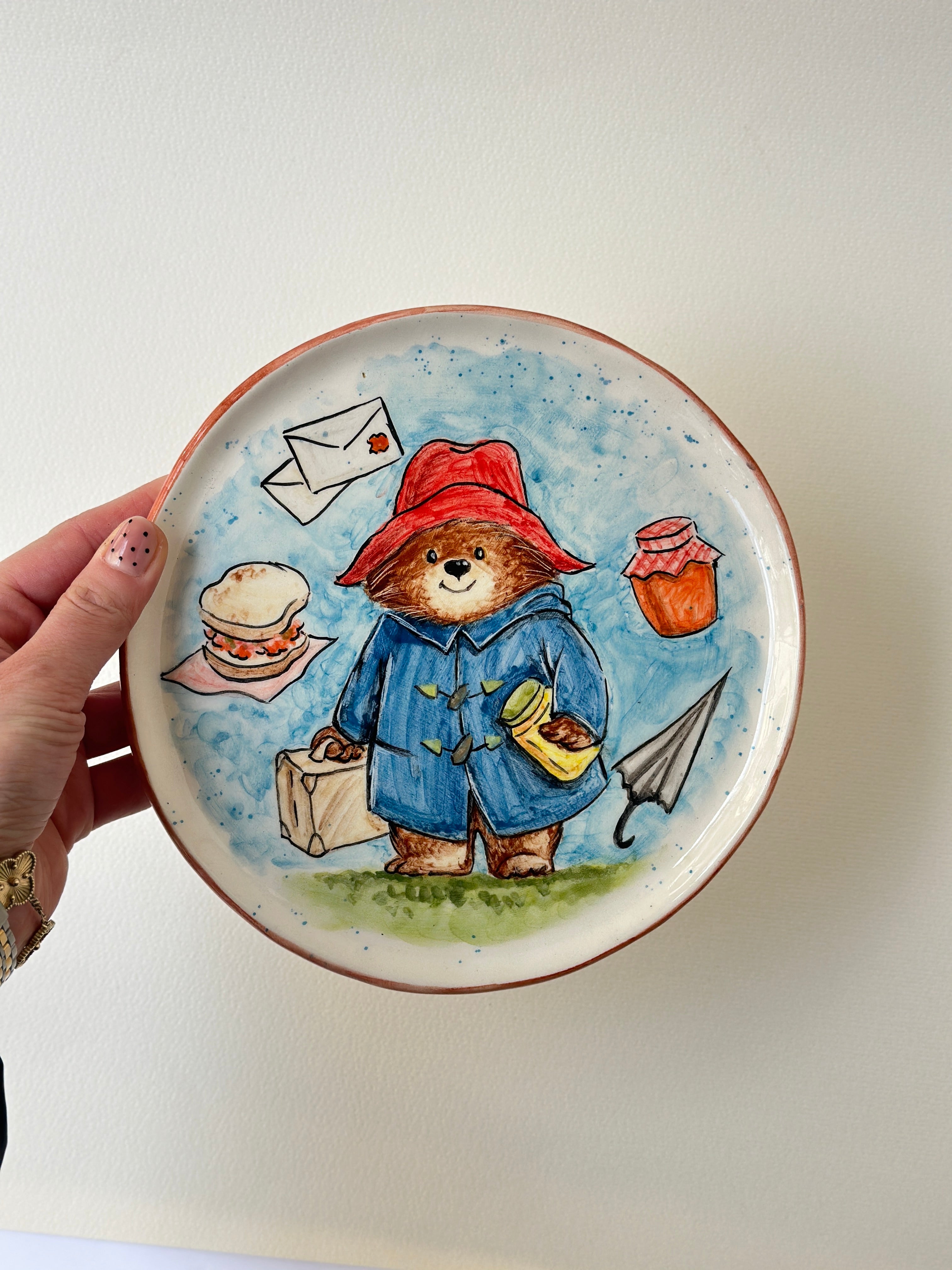 A red- padded Bear who loves marmalade handmade plate