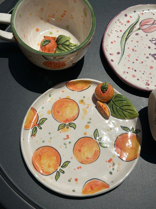 Orange handmade cup and plate